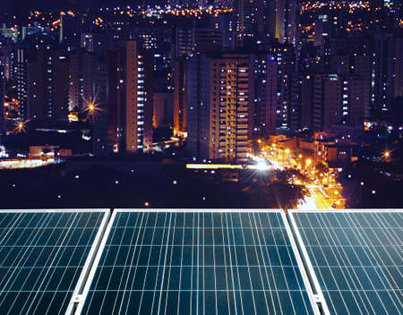 Photovoltaic panels at city night - Solar Energy Imageの写真素材