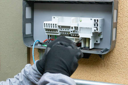 Cleaning and maintenance of the solar inverter. Solar energy concept image.の写真素材