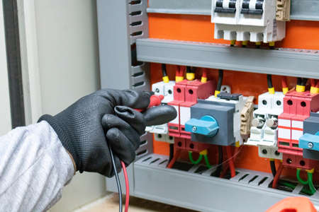 Cleaning and maintenance of the solar inverter. Solar energy concept image.の写真素材