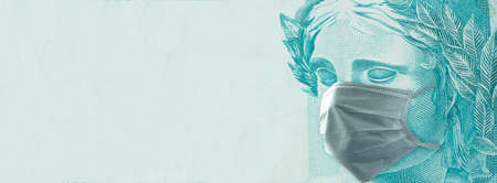 Coronavirus mask on Brazilian money. Concept of economy crisisの写真素材