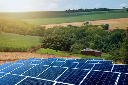 Sunset over Solar energy Farm plant.の写真素材