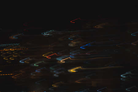 Lights trails in the black background. Color overlay light pattern.の写真素材