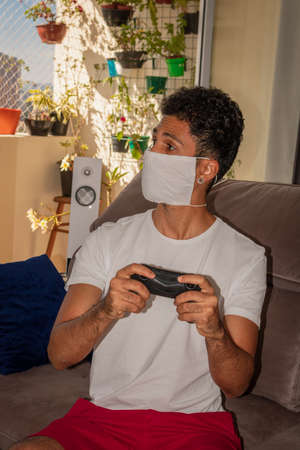 Man wearing protective mask against the coronavirus in house quarantine.