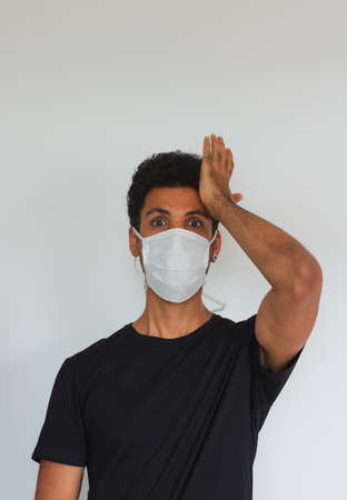 Man adult black wearing coronavirus mask isolated on whiteの写真素材