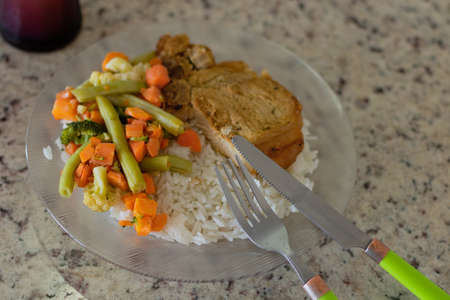 Dish with rice and beans and pork ribs on the counter. Brazilian culture food.の写真素材