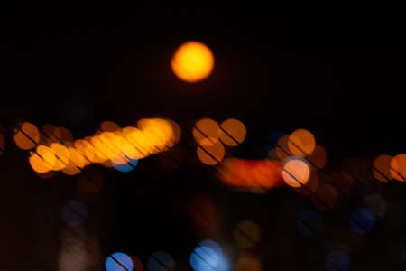 Bokeh city lights in black background. Color overlay light patternの写真素材