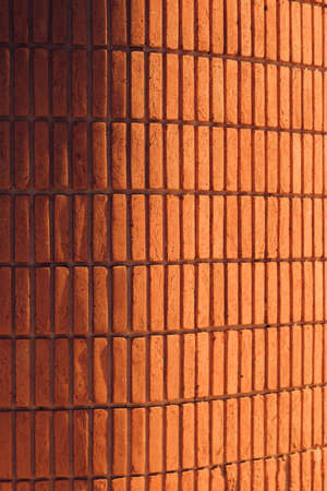 Brick Wall if orange texture in sunset.