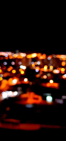 City lights bokeh circles on blackの写真素材