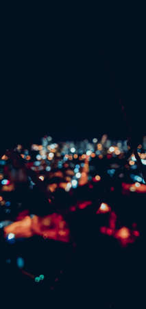 City lights bokeh circles on blackの写真素材
