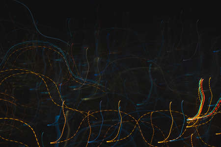 Futuristic overlay light pattern. Lights trails in the black background. Color overlay light...