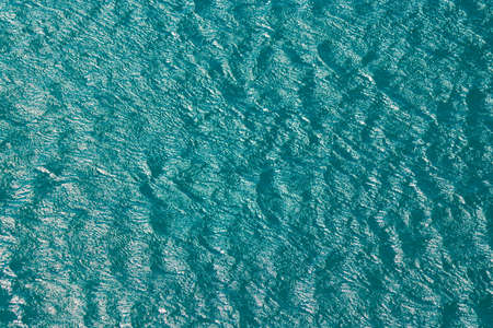 Sea texture background. Blue green water on brazilian waves.の写真素材