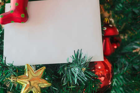 Christmas template background with space text for invitation letter or inbound email marketing. Surrounded by holiday decorations.の写真素材