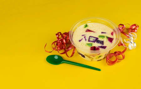 Brazilian famous jelly sweet. Colorful gelatin over yellow background.