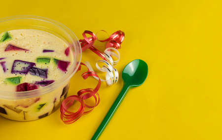 Brazilian famous jelly sweet. Colorful gelatin over yellow background.