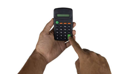Holding electronic calculator isolated on white background. Male hand holding electronic.の写真素材