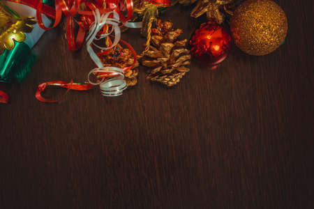 Various Christmas and New Year's gifts of handmade ornaments on a wood table.