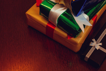 Various Christmas and New Year's gifts of handmade ornaments on a wood table.