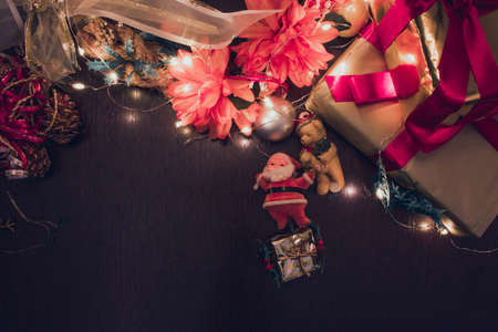 Christmas gift box. Christmas presents in red boxes at wooden table. Flat lay with copy space.の写真素材