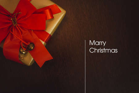 Christmas card with blurred background written Merry Christmas on white background.