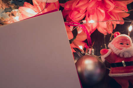 Christmas blank card with blurred background with Santa Claus, gifts and Christmas ornaments. Space for text.の写真素材