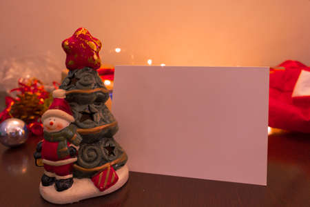 Christmas blank card with blurred background with Santa Claus, gifts and Christmas ornaments. Space for text.の写真素材
