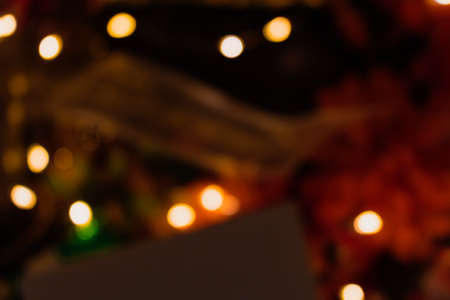 Christmas blurred background with gifts, ornaments and lights.