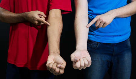 Multiethnic and multicultural friends. Mixed race young men isolated on black background. Diversity,...