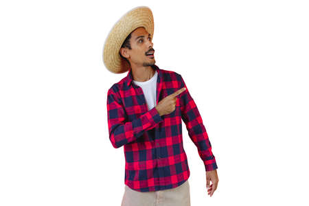 Man With Hat and Junina Party Shirt Isolated on White Background. Young man wearing traditional clothes for Brazilian June festival.の写真素材