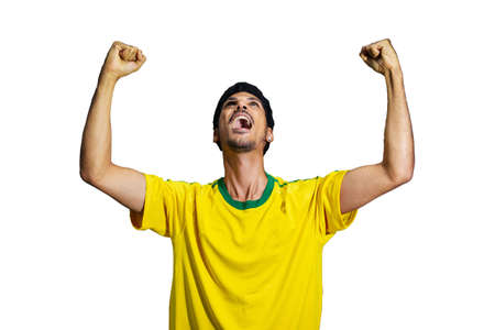 Male athlete or fan in yellow uniform celebrating isolatedの写真素材