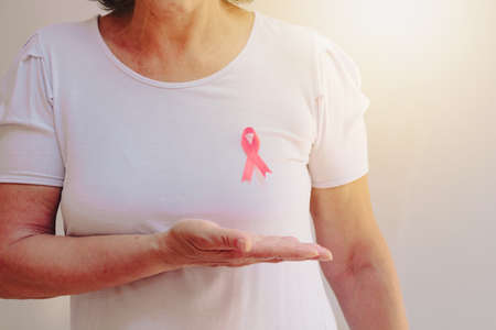 Mature White Woman With pink ribbon isolated.の写真素材