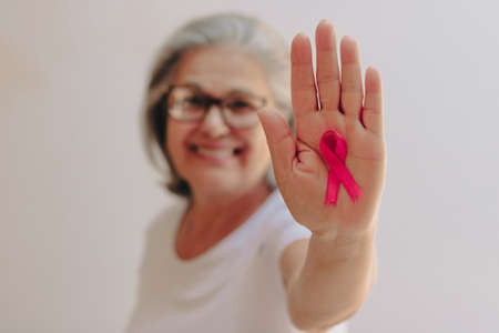 Mature White Woman With pink ribbon isolated.の写真素材