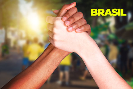 Brazilian Fans, Multiethnic Hands Shaking on Cinematic Background. For social media with copy space.の写真素材