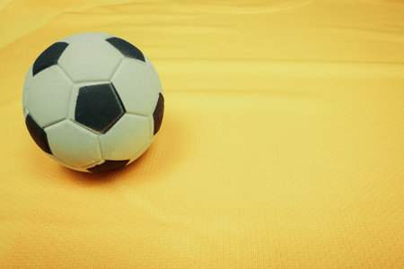 Soccer Ball on Yellow Background for Social Media, space for text. Ball on brazil jersey.のeditorial素材