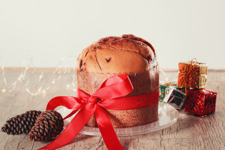 Fruit and Chocolate Chips Cake Served on a Wood Table decorated for Christmas. Homemade Christmas...