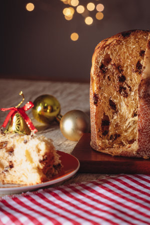 Fruit and Chocolate Chips Cake Served on a Wood Table decorated for Christmas. Homemade Christmas Even Bread on Blurry Background, Copy Space.の写真素材