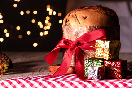 Fruit and Chocolate Chips Cake Served on a Wood Table decorated for Christmas. Homemade Christmas Even Bread on Blurry Background, Copy Space.の写真素材