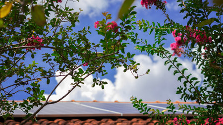 Solar Panels on the Roof in a Sunny and Cloudy Day. Photovoltaic Installation Plant in a House With...