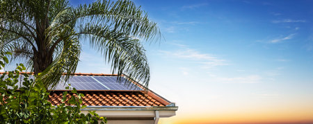 Solar Panels on the Roof in a Sunny and Cloudy Day. Photovoltaic Installation Plant in a House With...
