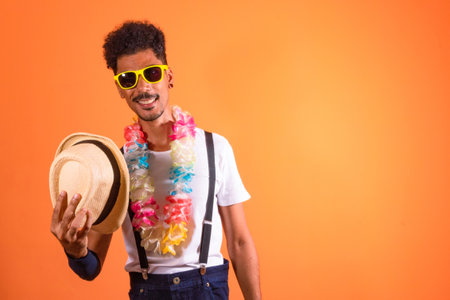 Carnival Outfit Party. Portrait of Black Man With Carnival Props Having Fun, Isolated on Orange...