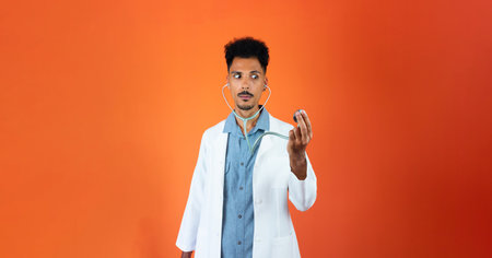 Black Young Doctor or Veterinarian Medical Resident With Stethoscope Pointing Isolatedの写真素材