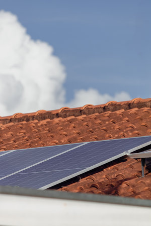 Photovoltaic Panels at Roof Solar in a Cinematic Day.