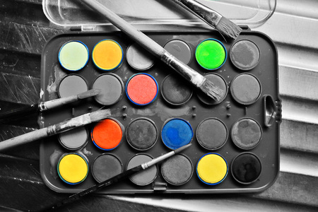 Watercolor set with brushes in black and white with a pop of colorの写真素材