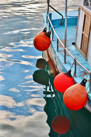 Close-up of buoys attached on a fishing boatの写真素材