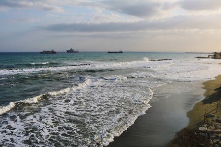 Waves splashing on a Mediterranean beach in winterの写真素材