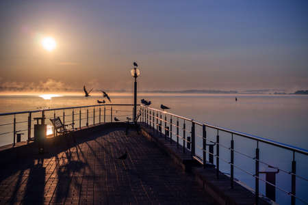 Sunrise at pier Misk Seaの写真素材