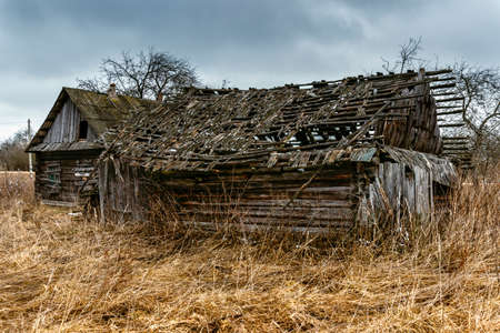 Old abandoned wooden house with boarded up windowsの写真素材