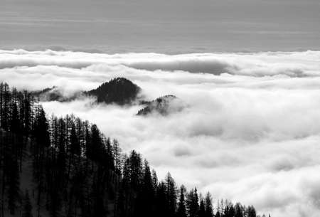Sunny day on dolomites, sea of clouds in black and whiteの写真素材