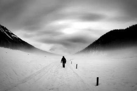 People walking and hiking in the snow on dolomites, inside the snowstormの写真素材