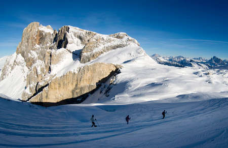 People walking and hiking in the snow on Dolomitesの写真素材