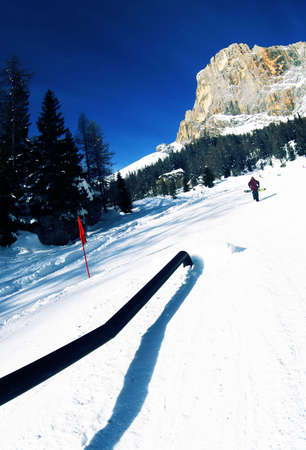 Snowboarder in the snowpark just below dolomitesの写真素材